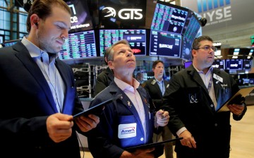 Traders work on the floor of the New York Stock Exchange (NYSE) in New York City, U.S.,