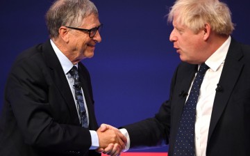 Britain's Prime Minister Boris Johnson and Bill Gates shake hands during the Global Investment Summit at the Science Museum, in London, Britain,