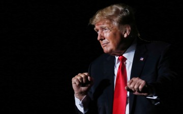 Former U.S. President Donald Trump reacts after his speech during a rally at the Iowa States Fairgrounds in Des Moines, Iowa, U.S.