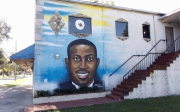 A mural of Ahmaud Arbery is painted on the side of The Brunswick African American Cultural Center in downtown Brunswick, Georgia, U.S