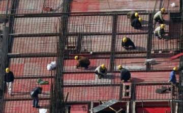 Laborers work at a construction site in Shanghai, Jan. 16, 2014.