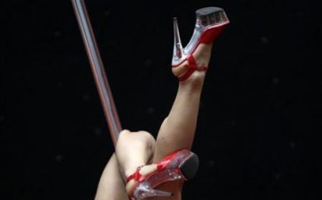A contestant competes during the 2nd China Pole Dance semi-final in Tianjin municipality.