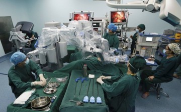 Doctors operate on a patient in Hefei, Anhui Province, Sept. 24, 2014.