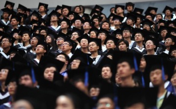 Students attend a graduation ceremony in Shanghai’s Fudan University. 