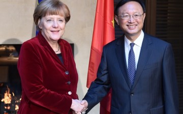 German Chancellor Angela Merkel meets State Councilor Yang Jiechi (R) during the 51st Munich Security Conference at the Bayerischer Hof hotel in Munich on Feb. 7.