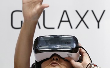A visitor tries out Samsung's Galaxy Gear VR at its booth in Tokyo Game Show 2014 in Makuhari, east of Tokyo September 18, 2014. About 421 companies and organizations are participating in the Tokyo Ga