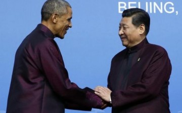 U.S. President Barack Obama (L) shakes hands with Chinese President Xi Jinping.