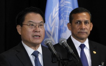 UNIDO director-general Li Yong (L) speaks to the media, while Peruvian President Ollanta Humala listens, following a meeting at the United Nations headquarters in New York, Sept. 23, 2013.