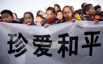 Children hold a banner saying 