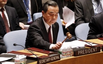 Chinese Foreign Minister Wang Yi presides over a U.N. Security Council meeting. 
