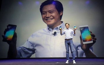 Xiaomi CEO Lei Jun shows a pair of Mi Note smartphones at a launch ceremony in Beijing on Jan. 15.