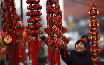 A woman looks at Chinese Lunar New Year decorations.