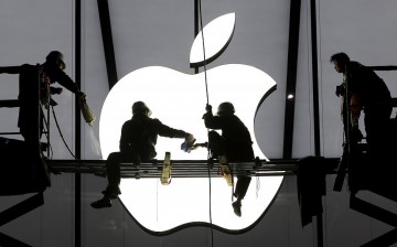 Workers prepare for the opening of an Apple store in Hangzhou, Zhejiang Province, Jan. 23, 2015.