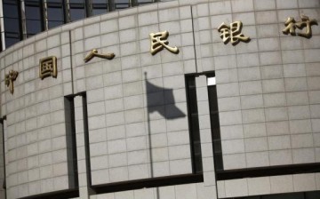 The People's Bank of China makes borrowing money cheaper by further cutting down interest rates.