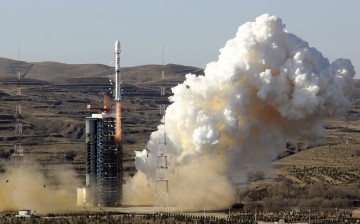 A Long March-4B rocket loaded with the CBERS-4 satellite blasts off from its launch pad at the Taiyuan Satellite Launch Center in Taiyuan, Shanxi Province, Dec. 7, 2014. 