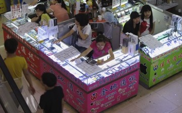 Smartphones and tablets are being sold in booths at a mall in Shenzhen.