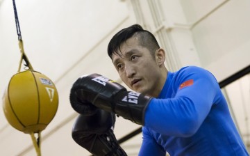 Zou Shiming of China works out in front of the media at the Venetian Macao hotel in Macau, March 5, 2015.