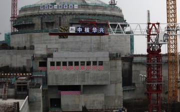 Workers stand in front of a nuclear reactor in Taishan in Guangdong Province. 