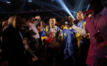 Zou Shiming of China walks to the ring before his International Boxing Federation (IBF) world flyweight title fight against Thai Amnat Ruenroeng at the Venetian Macao hotel in Macau, March 7, 2015.