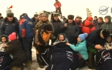 NASA astronaut and two Russian cosmonauts landed safely in a snow-covered Kazakh steppe.