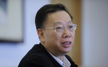 Then Deputy Health Minister Huang Jiefu speaks during a group session of the Chinese People's Political Consultative Conference (CPPCC) in Beijing, March 10, 2011.