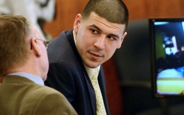 Former New England Patriots football player Aaron Hernandez (R) confers with his attorney Charles Rankin during his murder trial in Fall River, Massachusetts March 13, 2015.