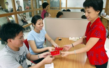 Chinese newlyweds receive their marriage certificates in Guangzhou.