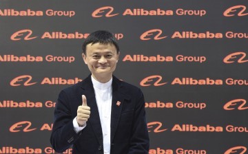 Alibaba founder and chairman Jack Ma poses for the media while touring the CeBIT trade fair in Hannover, March 16, 2015.