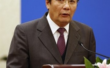 Finance Minister Lou Jiwei states that the government is under pressure to meet its revenue budget target.
