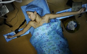 A patient undergoes a breast implant surgery at a hospital in Hefei, Anhui Province.
