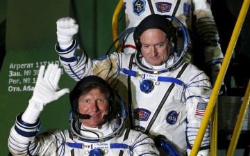U.S. astronaut Scott Kelly (C), Russian cosmonauts Gennady Padalka, and Mikhail Korniyenko (top)