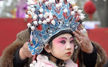 A young performer readies herself during a performance at the Lunar New Year in Taiyuan, Shanxi Province.