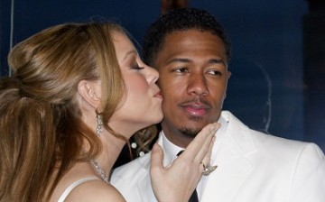 Musician Mariah Carey and husband Nick Cannon attend a photo call near the Eiffel Tower before their vow renewal ceremony in Paris April 27, 2012