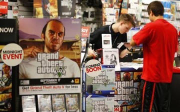A photo showing people buying the latest Grand Theft Auto V game.