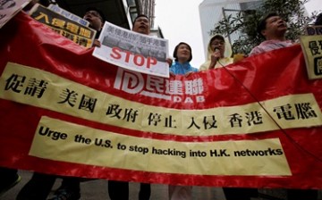 Protesters from Democratic Alliance for the Betterment of Hong Kong (DAB) march to the U.S. Consulate in Hong Kong to protest the United States government hacking into Hong Kong computers.