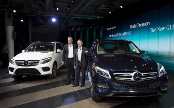 Mercedes-Benz USA officials Wolf-Dieter Kurz (L) and Stephen Cannon present the new Mercedes-Benz GLE 550 e 4MATIC and the new GLE 35 4MATIC at the 2015 New York International Auto Show in New York.