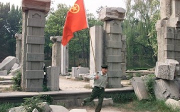 A People's Liberation Army soldier at the ruins of the Old Summer Palace (Yuanmingyuan) as he and his comrades visited the palace to commemorate the anniversary of the May Fourth Movement.