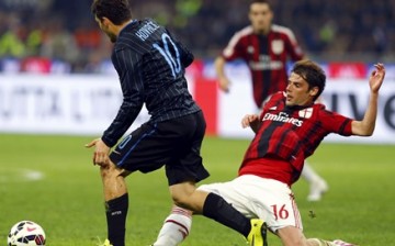 AC Milan's Andrea Poli with Inter Milan's Mateo Kovacic during their Serie A soccer match at the San Siro stadium in Milan.
