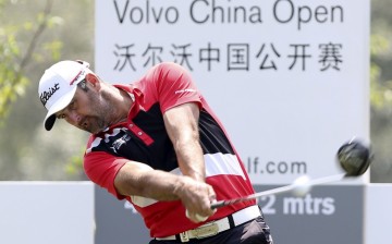 Michael Hendry of New Zealand tees off during the first day of the China Open at Tomson Golf Club in Pudong, Shanghai, April 23, 2015.