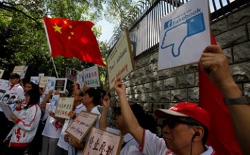 Chinese demonstrators protest in 2013 outside the U.S. Consulate in Hong Kong over claims from Edward Snowden that the National Security Agency (NSA) hacked computers in the Chinese territory.