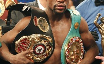 Floyd Mayweather, Jr. of the U.S. poses with his title belts after defeating Manny Pacquiao of the Philippines in their welterweight WBO, WBC and WBA (Super) title fight in Las Vegas, Nevada, May 2, 2015.    