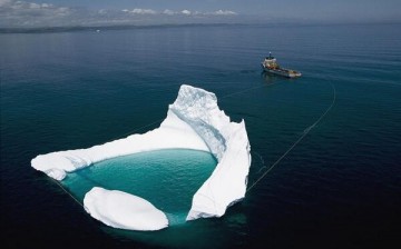 ship towing an iceberg
