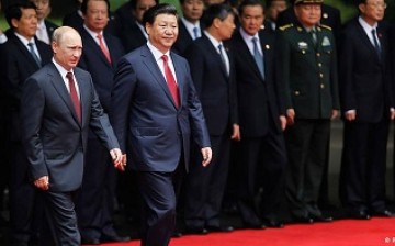 President Xi meets Putin in Shanghai during a two-day visit to China last year, where he was expected to sign a deal on gas supply and infrastructure projects with the Chinese government. 