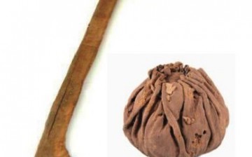 A photo of the ancient leather ball and polo stick found in the ancient Yanghai Tombs in Turpan.