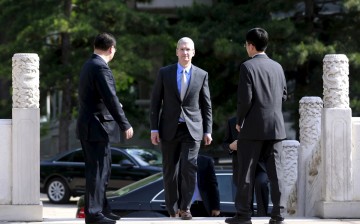 Apple CEO Tim Cook arrives in Beijing to meet with Chinese Vice Premier Liu Yandong on May 12, 2015. Cook is in China to discuss forest conservation as well as to promote the Apple Pay service. 