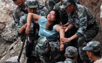 Rescuers save an injured woman after an earthquake hit Baosheng Township in Lushan County, Ya'an City, in southwest China's Sichuan Province.