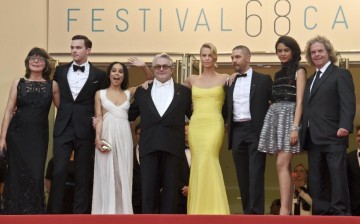 Margaret Sixel (L), Nicholas Hoult, Zoe Kravitz, George Miller, Charlize Theron, Tom Hardy, Courtney Eaton and Doug Mitchell pose as they arrive for the screening of 