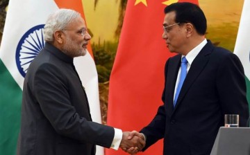 Indian Prime Minister Narendra Modi shakes hands with Chinese Premier Li Keqiang after a joint press conference in the Great Hall of the People in Beijing.