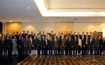 Officials and members of the China-led AIIB pose for a picture during the recent meeting held in Singapore.