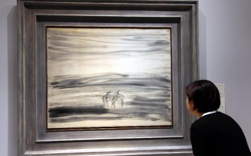 A visitor is seen during the preview of Christie's Hong Kong 2015 spring season in Hong Kong, south China, May 28, 2015. The auction will be held from May 30 to June 3. 